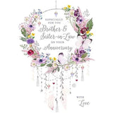 Nigel Quiney anniversary greeting card featuring floral wreath and dream catcher design for brother and sister-in-law from NQ.