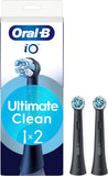 Two black Oral-B iO Ultimate Clean replacement brush heads for electric toothbrushes, shown with bristles and sleek design.