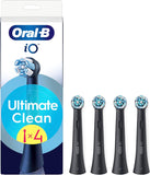 Four black Oral-B iO Ultimate Clean replacement brush heads for electric toothbrushes, designed for optimal oral hygiene.
