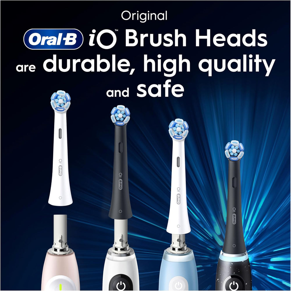 Eight white Oral-B iO Ultimate Clean replacement brush heads for electric toothbrushes, shown in a pack.