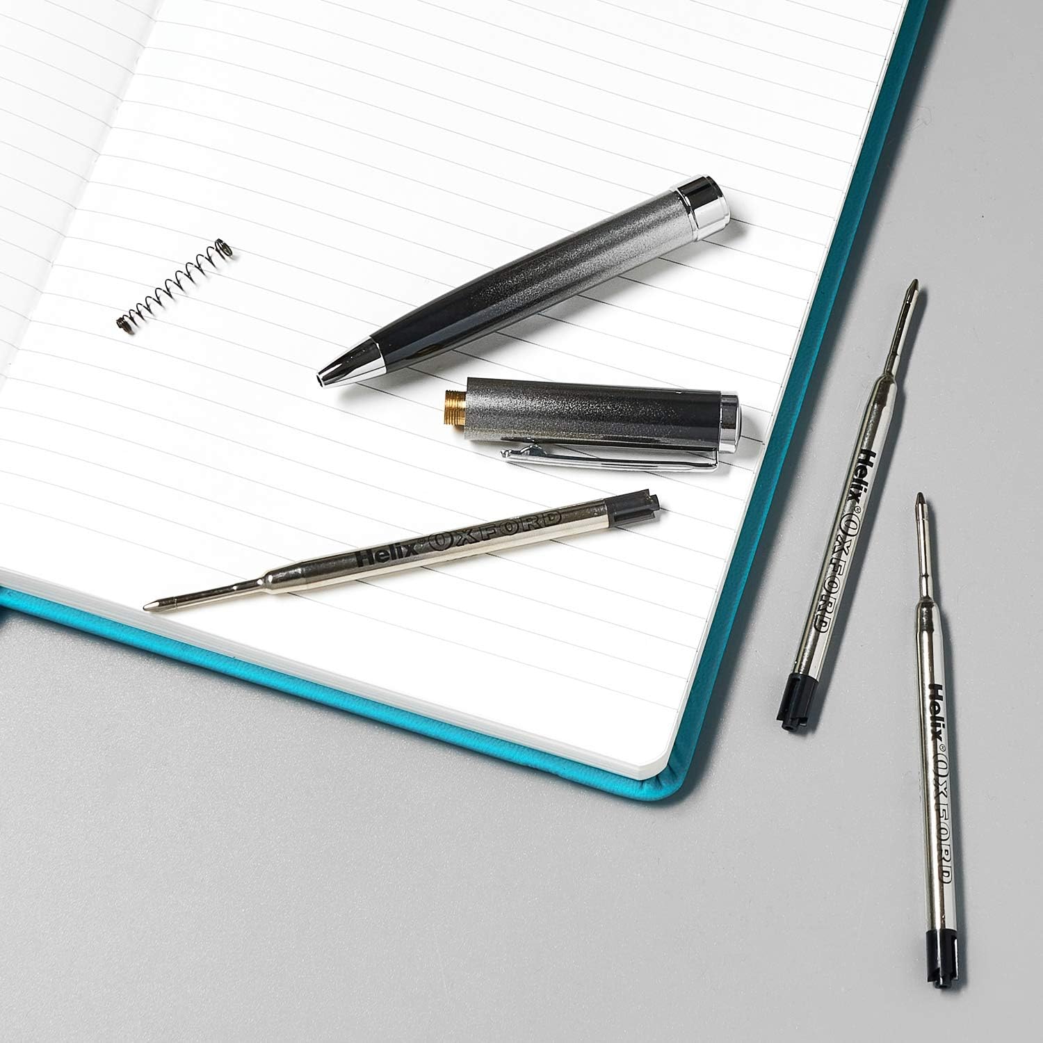 Pack of two Oxford Helix ballpoint pen refills with black ink, shown in a close-up image of the refill tips and packaging.