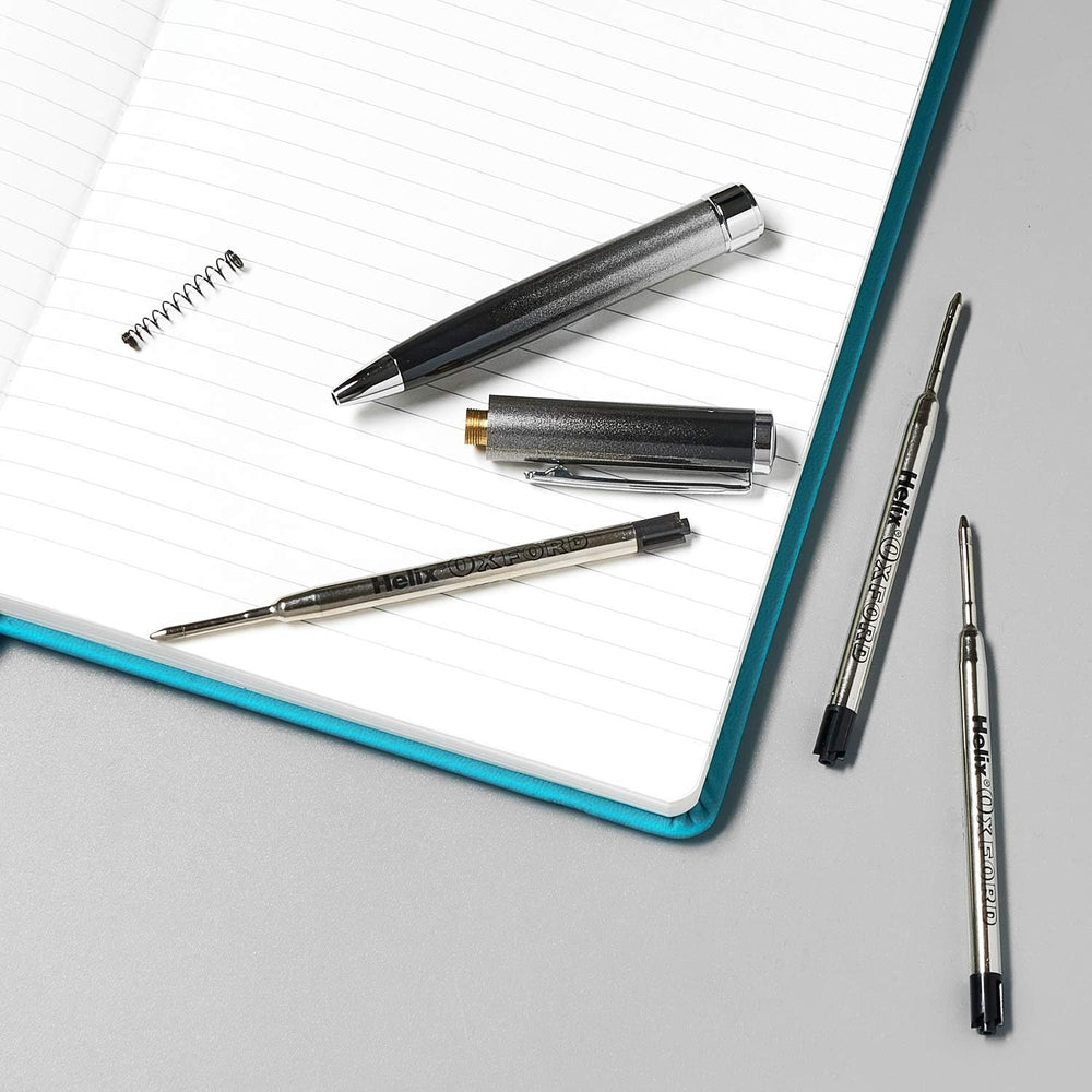 Pack of two Oxford Helix ballpoint pen refills with black ink, shown in a close-up image of the refill tips and packaging.