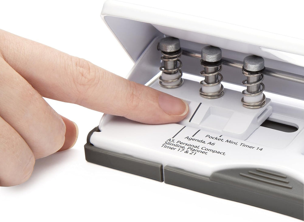 Rapesco 1321 white adjustable 6-hole diary punch with metal handle for punching up to 10 sheets of paper.