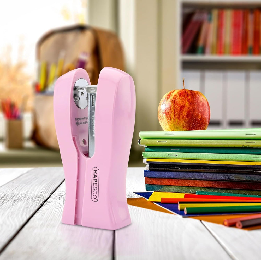 Rapesco Stand Up Space-Saving Stapler in candy pink, holds up to 20 sheets, compact design for easy stapling and storage.
