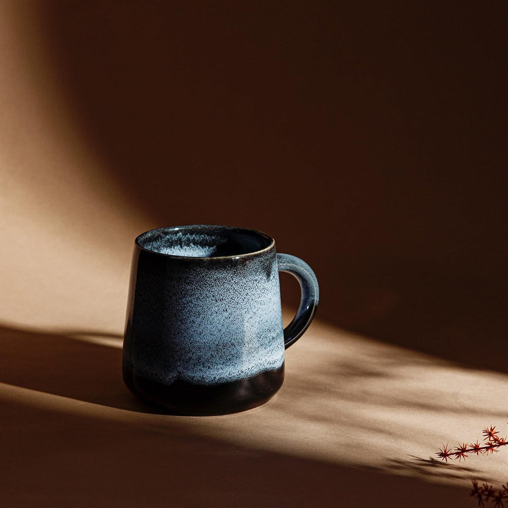 Sass & Belle Midnight Mojave Glaze Mug with a dark, glossy finish, perfect for hot beverages, on a plain background.