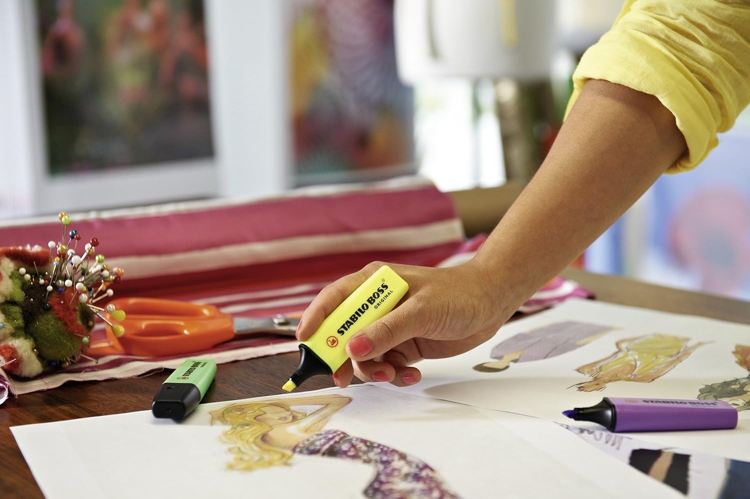 Set of four Stabilo Boss Original yellow highlighters with chisel tips, designed for vibrant highlighting and easy visibility.