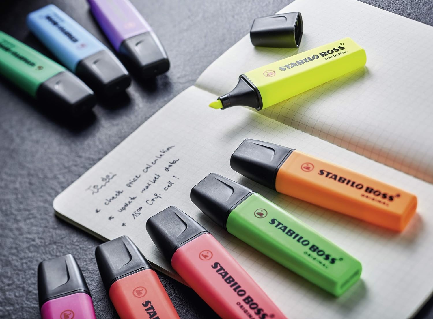 Set of four Stabilo Boss Original yellow highlighters, ideal for highlighting text with bright, visible color.