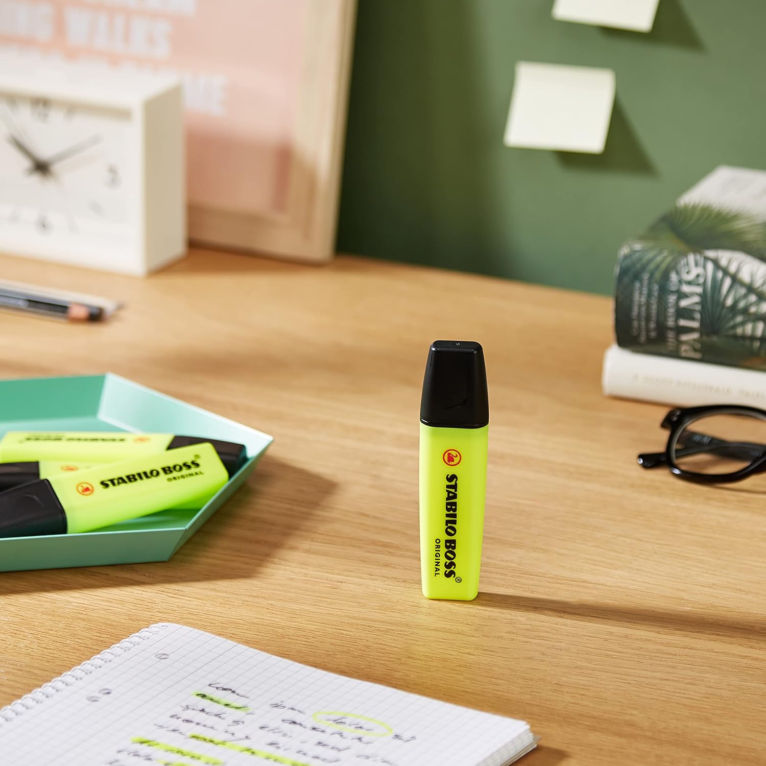 Set of four Stabilo Boss Original yellow highlighters with chisel tips for vibrant highlighting and marking.