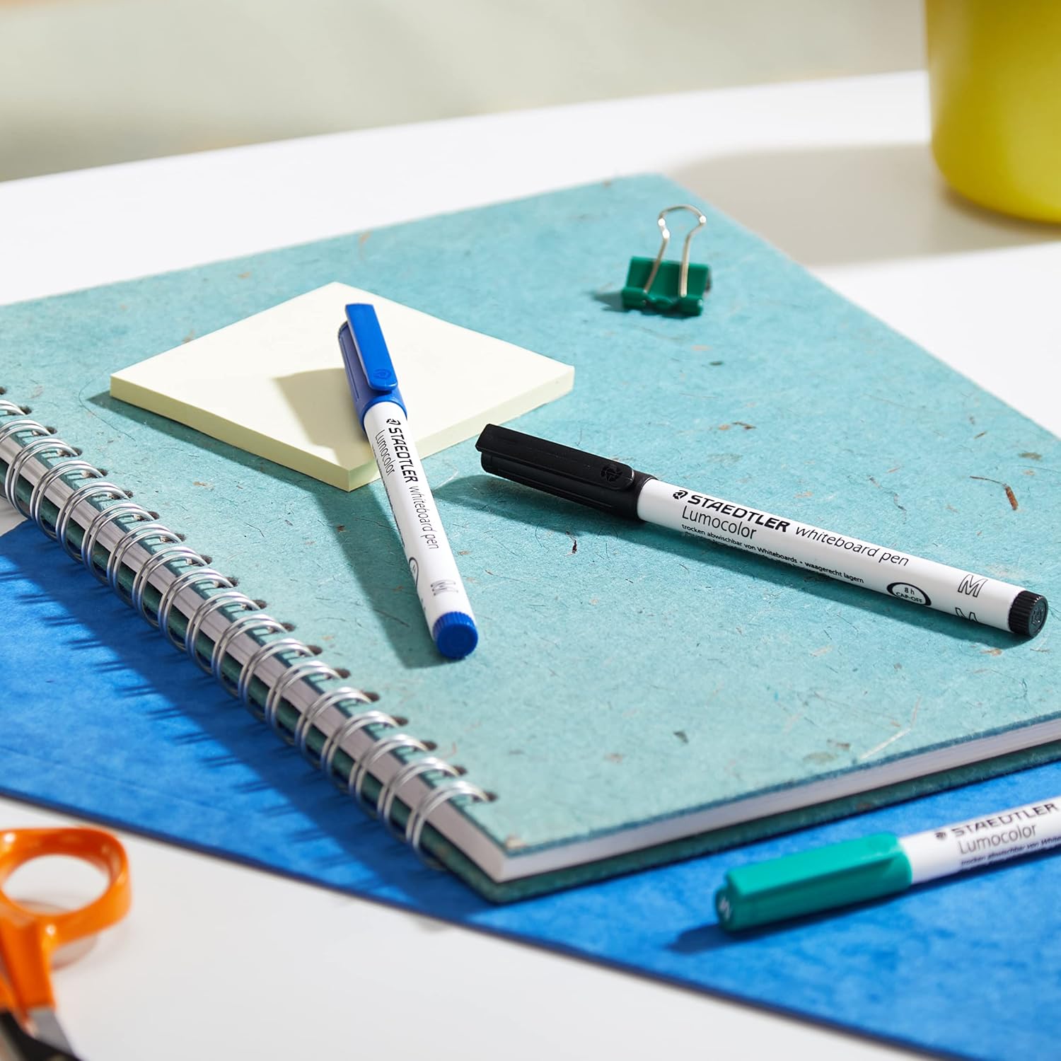 Set of four Staedtler Lumocolor 301 whiteboard pens in assorted colors, ideal for writing and drawing on whiteboards.