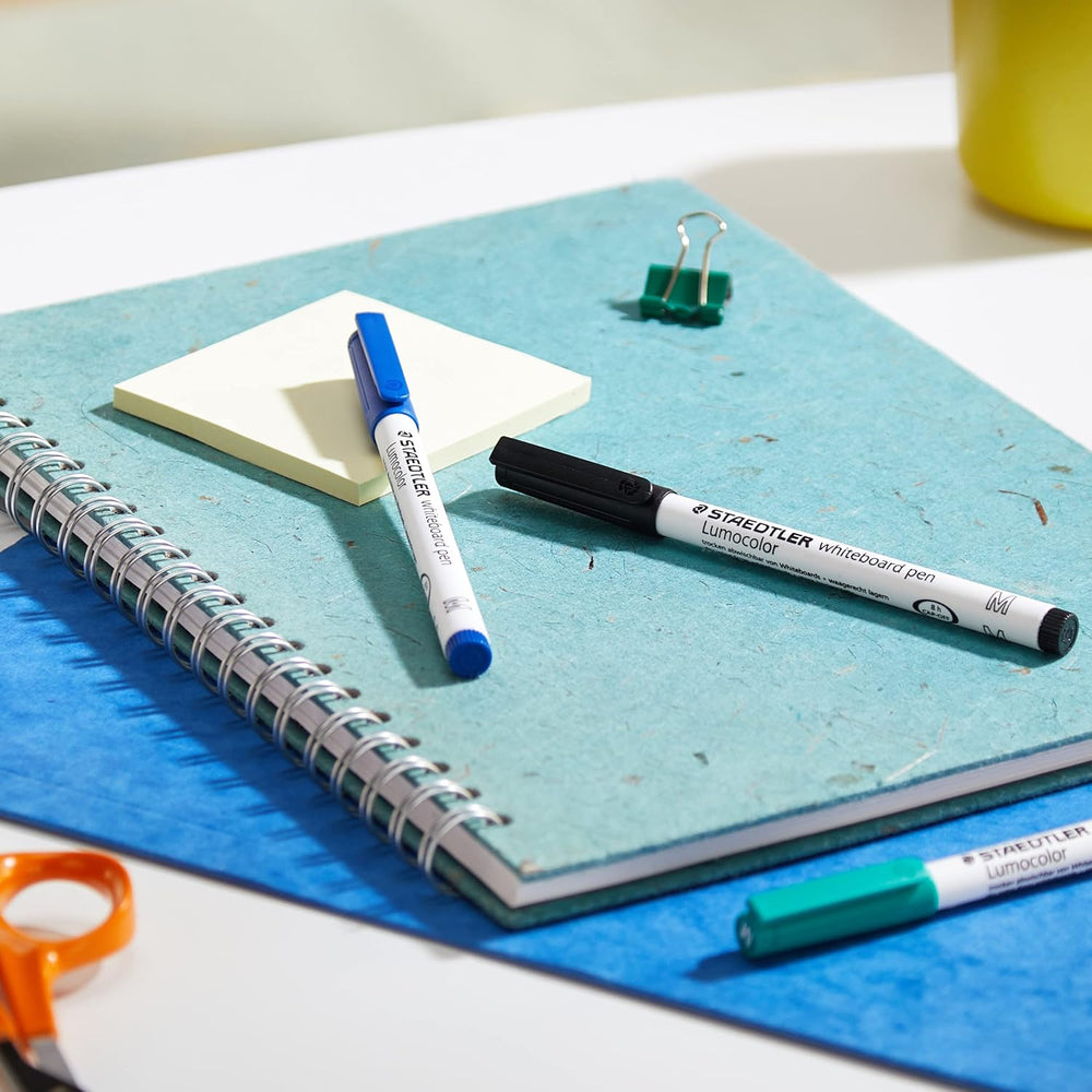 Set of four Staedtler Lumocolor 301 whiteboard pens in assorted colors, ideal for writing and drawing on whiteboards.