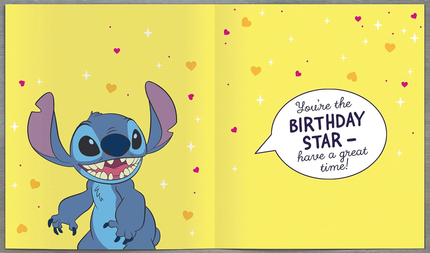 UK Greetings Disney Stitch girl 6th birthday card featuring colorful cartoon Stitch and festive birthday designs.