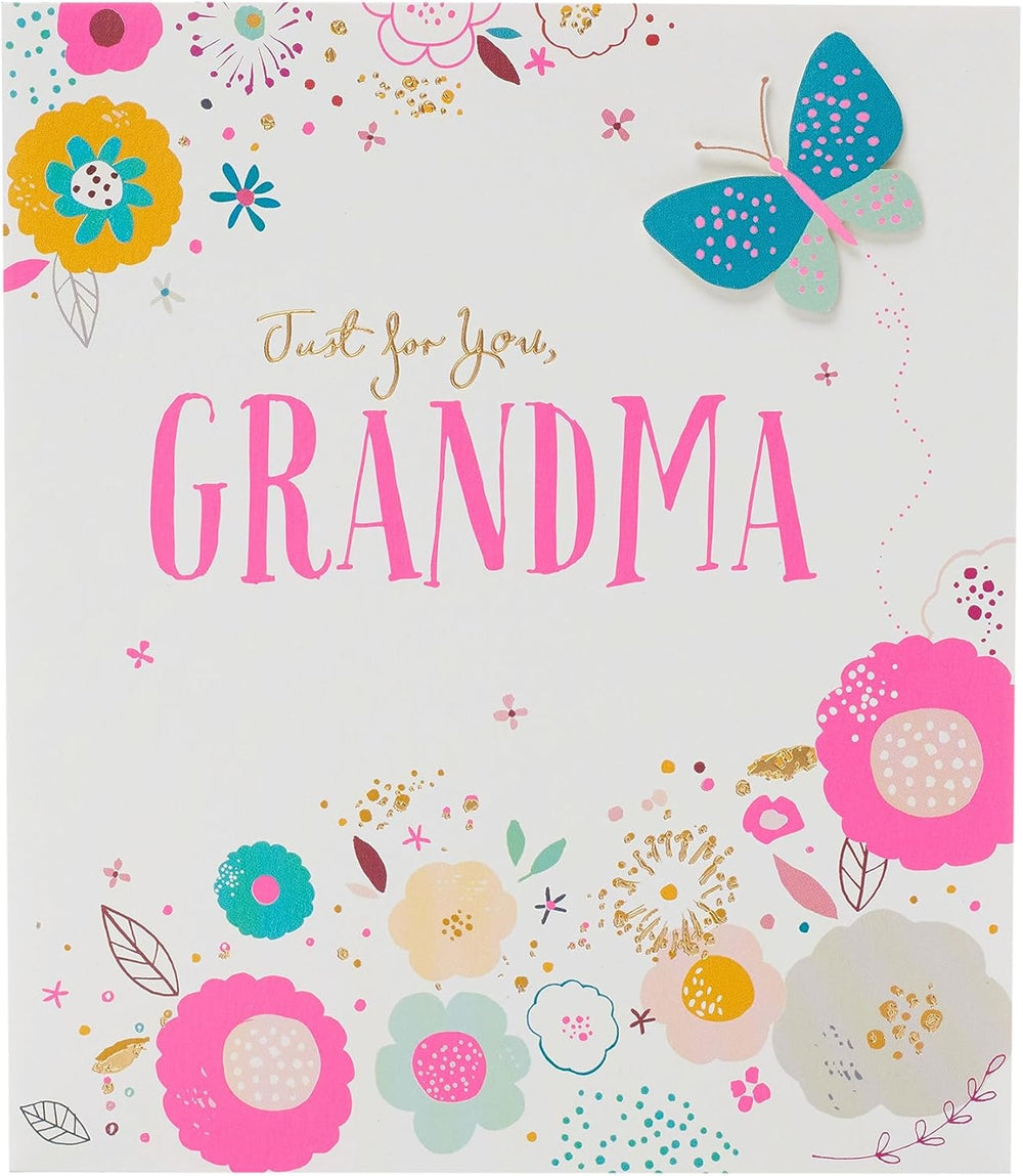 UK Greetings birthday card featuring an elegant flower and butterfly design with gold foil and 3D detailing.