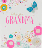 UK Greetings birthday card featuring an elegant flower and butterfly design with gold foil and 3D detailing.