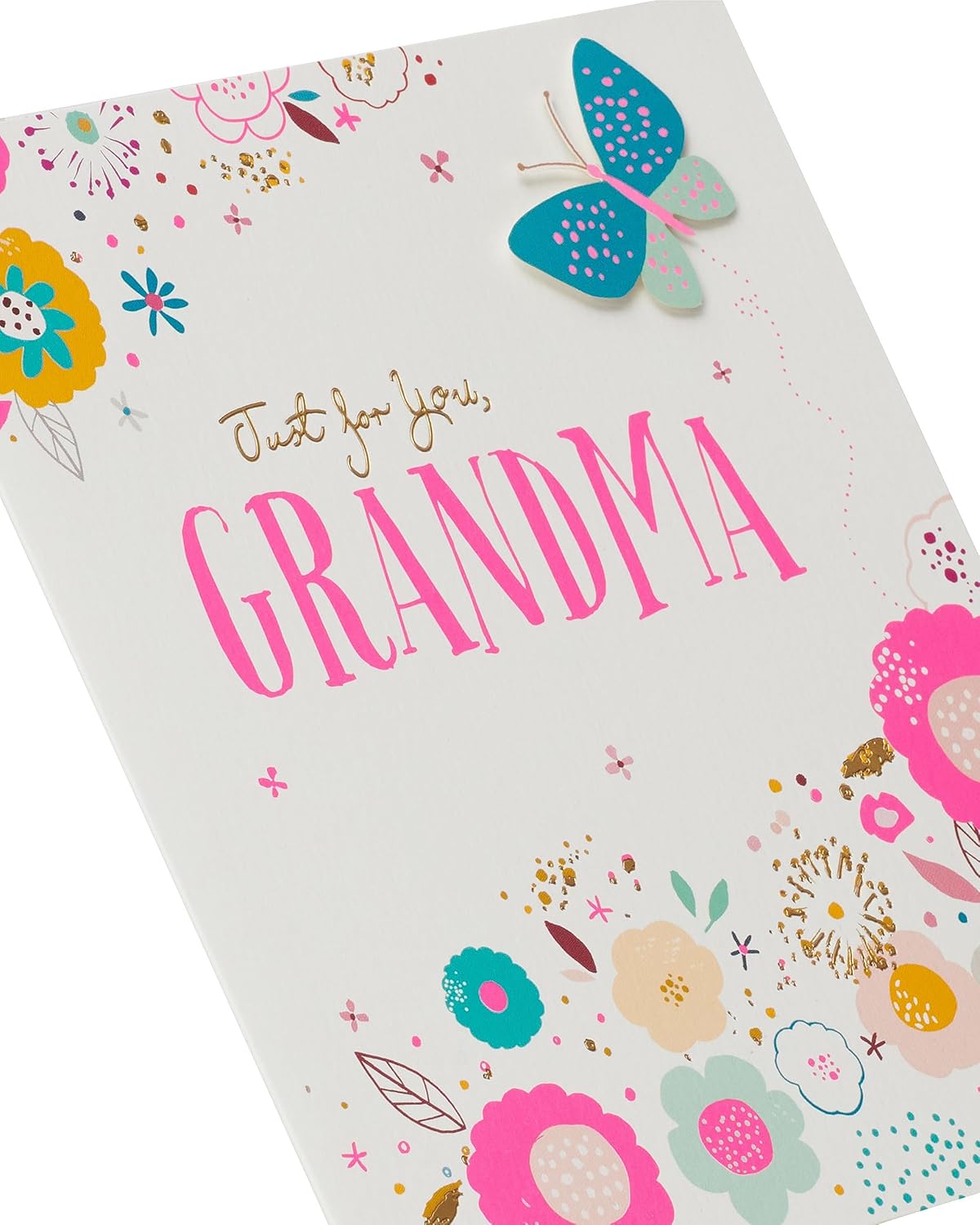 UK Greetings birthday card featuring an elegant flower and butterfly design with gold foil accents and 3D detailing.