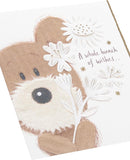 UK Greetings Lots of Woof birthday card featuring a cute, playful dog illustration for celebrating birthdays.