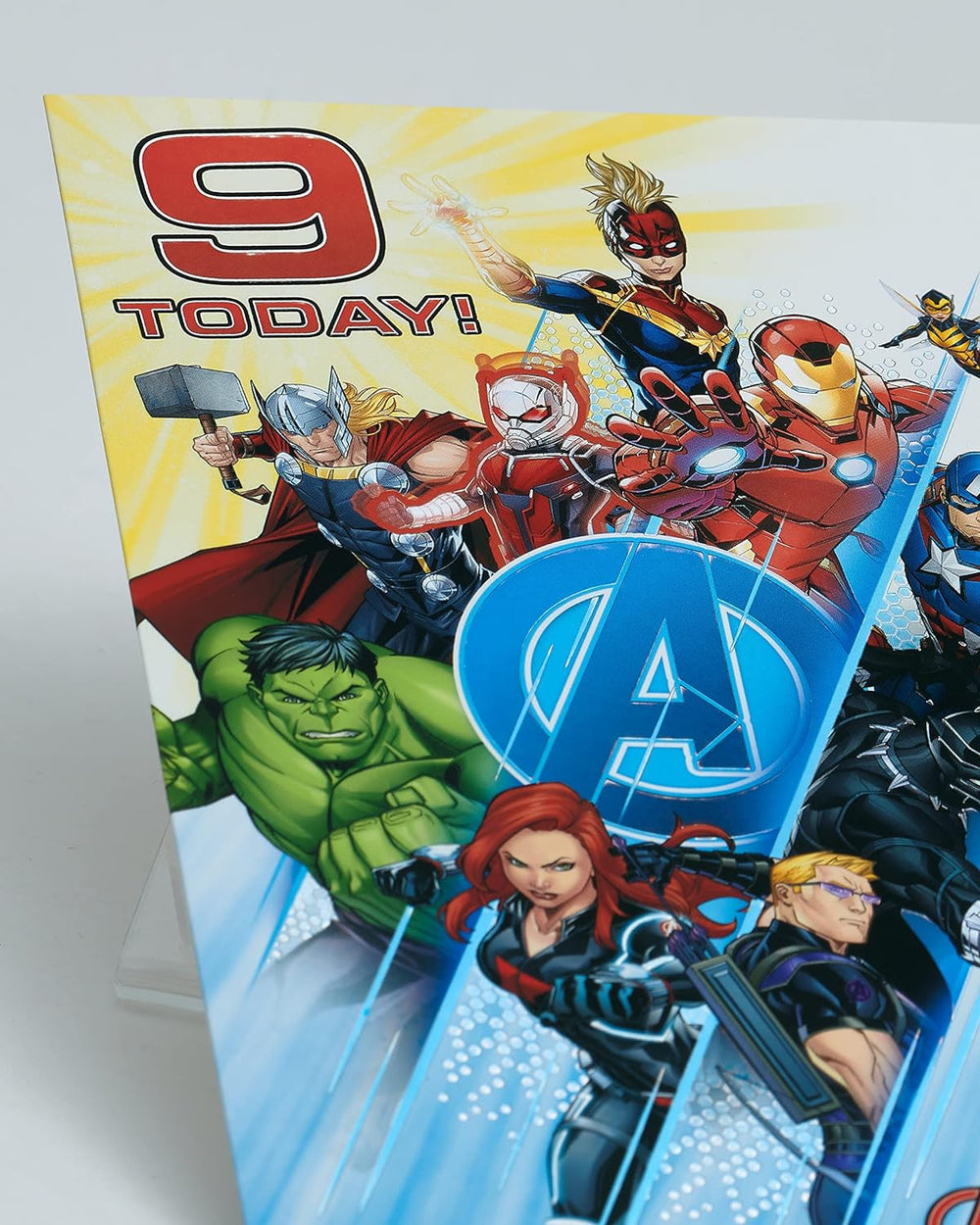 UK Greetings Marvel Avengers 9th birthday card with badge featuring superhero characters and vibrant design.