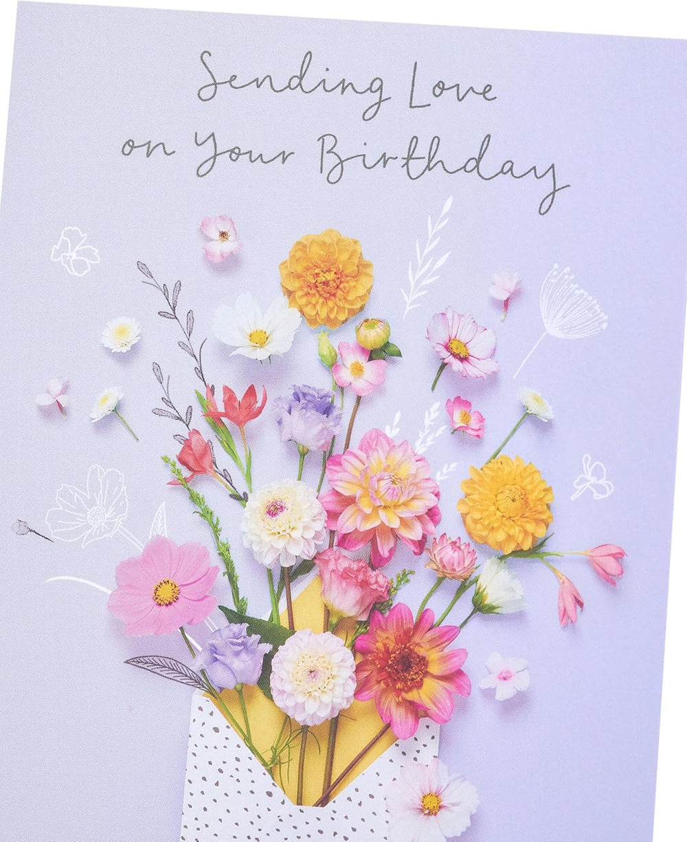 UK Greetings Meadows birthday card featuring elegant nature design, suitable for all ages, with colorful floral and outdoor imagery.