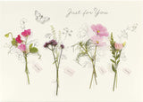 Set of six UK Greetings floral birthday cards featuring pretty, colorful floral designs for celebrating special occasions.