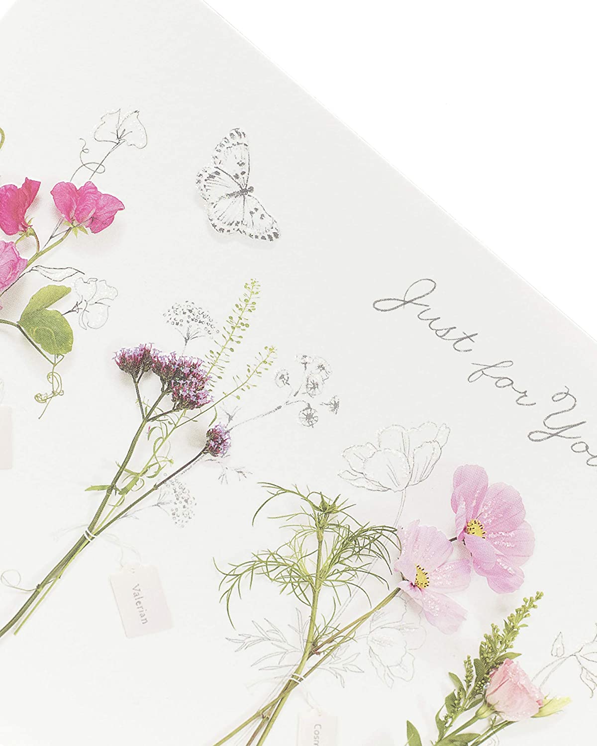 Set of six UK Greetings floral birthday cards featuring pretty floral designs, ideal for celebrating special occasions.