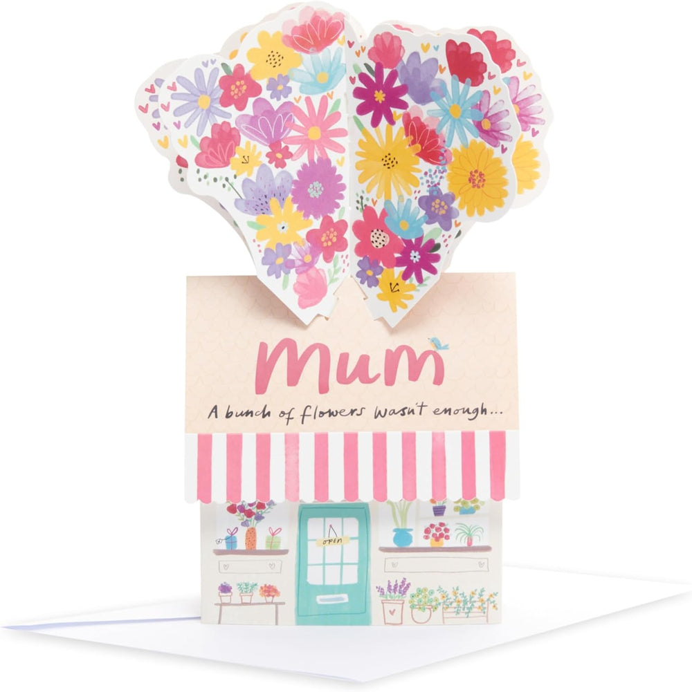 UK Greetings birthday card for mum featuring a pop-up flower shop design, with colorful floral illustrations.