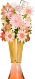 UK Greetings floral bottle topper, decorative bottle stopper accessory with vibrant floral design for wine or beverage bottles.