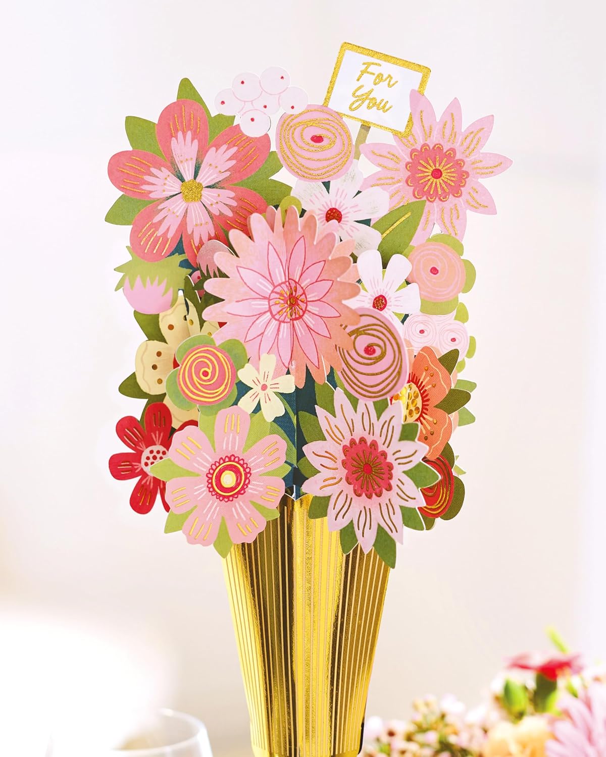 UK Greetings floral bottle topper accessory featuring a colorful floral design, perfect for sealing wine bottles.