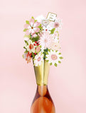 UK Greetings floral bottle topper, decorative glass bottle stopper with colorful floral design for wine or beverage bottles.
