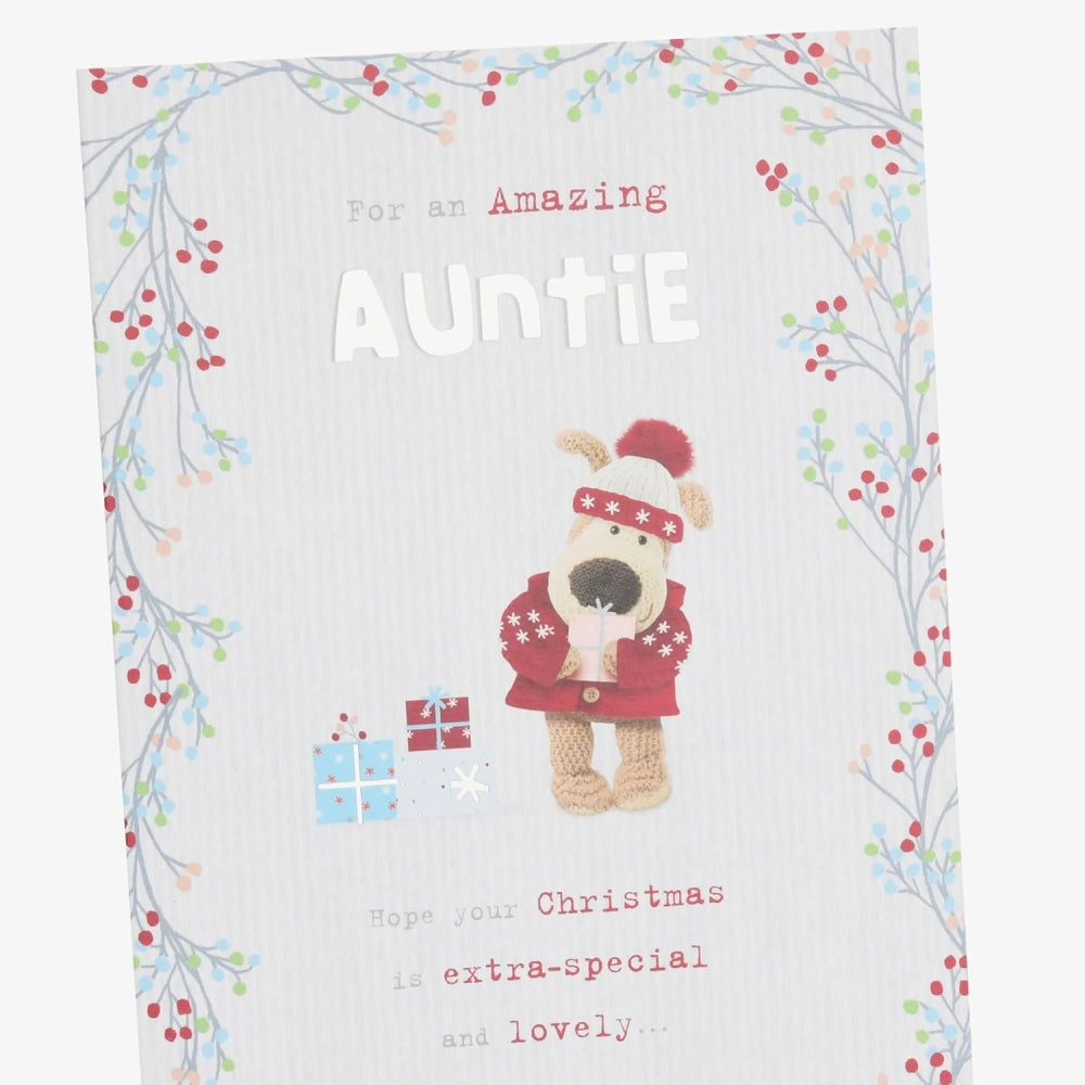 Boofle with presents Auntie Christmas Card from UK Greetings featuring a cute cartoon dog holding wrapped gifts.