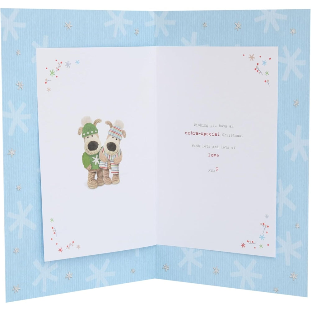 Boofles skating Christmas card from UK Greetings featuring a daughter and boyfriend in festive holiday scene.