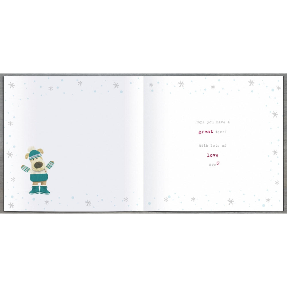 UK Greetings Boofle Christmas card featuring a friendly cartoon dog behind festive lettering, perfect for holiday greetings.
