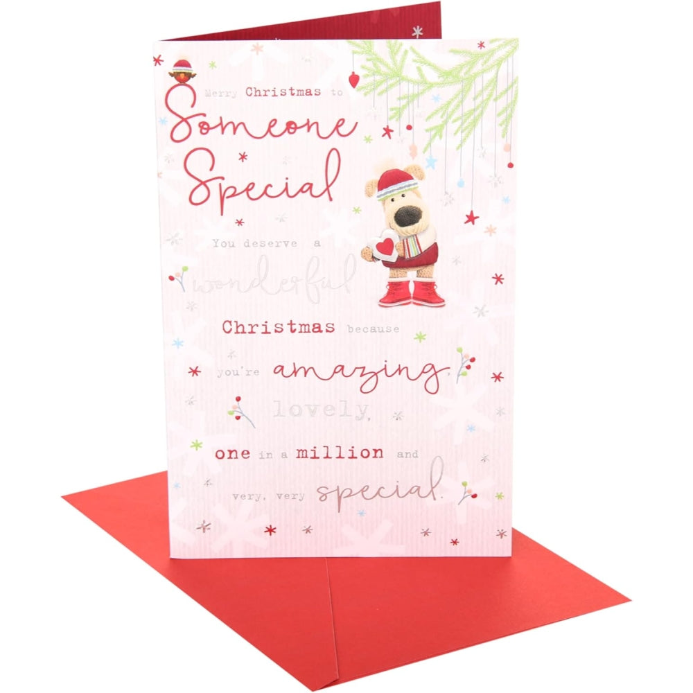 UK Greetings Boofle holding a small heart Christmas card featuring a festive design and a cute, lovable character.