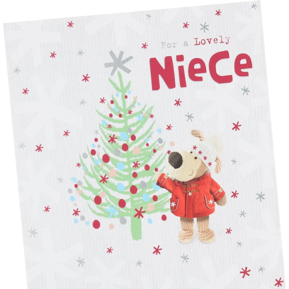 UK Greetings Boofle Christmas card featuring a festive scene with a cute Boofle character near a decorated Christmas tree.