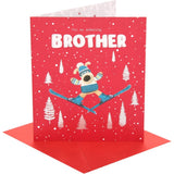 UK Greetings Boofle skiing brother Christmas card featuring festive holiday illustration with cheerful design and seasonal greetings.