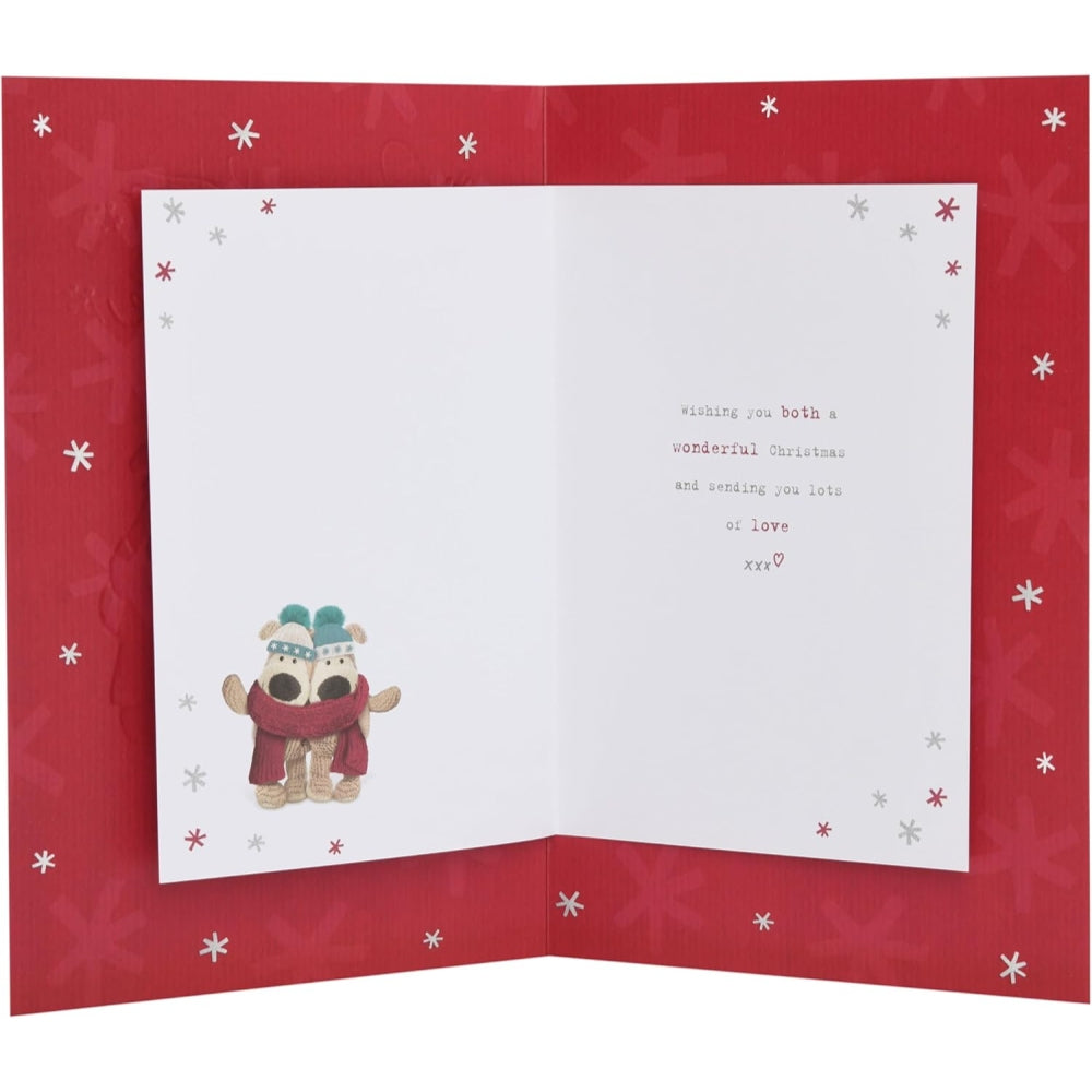 UK Greetings Christmas card featuring Boofles with daughter and fiancé near a decorated Christmas tree.
