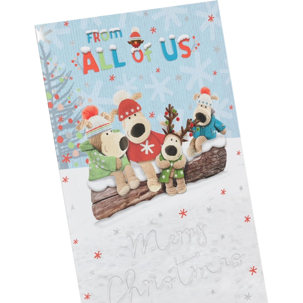 UK Greetings Christmas card featuring Boofles sitting on a log from the All of Us collection, festive holiday design.