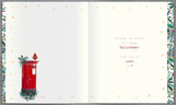 UK Greetings Boofle Christmas greeting card featuring cute cartoon dog for a special auntie and uncle.