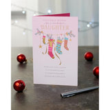 UK Greetings Christmas card for daughter featuring pink stockings design, festive holiday greeting with cheerful holiday imagery.