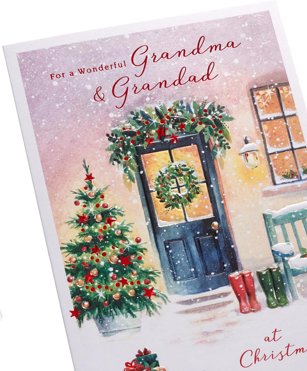 UK Greetings Christmas greeting card for Grandma and Grandad featuring a snowy door design, perfect for holiday wishes.