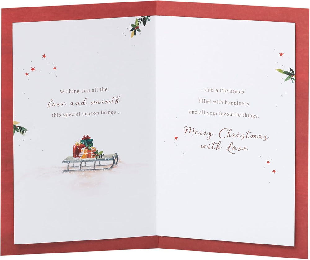 UK Greetings Christmas greeting card for grandma and grandad featuring a snowy door design with festive holiday imagery.