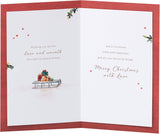 UK Greetings Christmas greeting card for grandma and grandad featuring a snowy door design with festive holiday imagery.