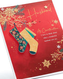 UK Greetings Christmas card for husband featuring a deep red and gold festive design, perfect for holiday greetings.
