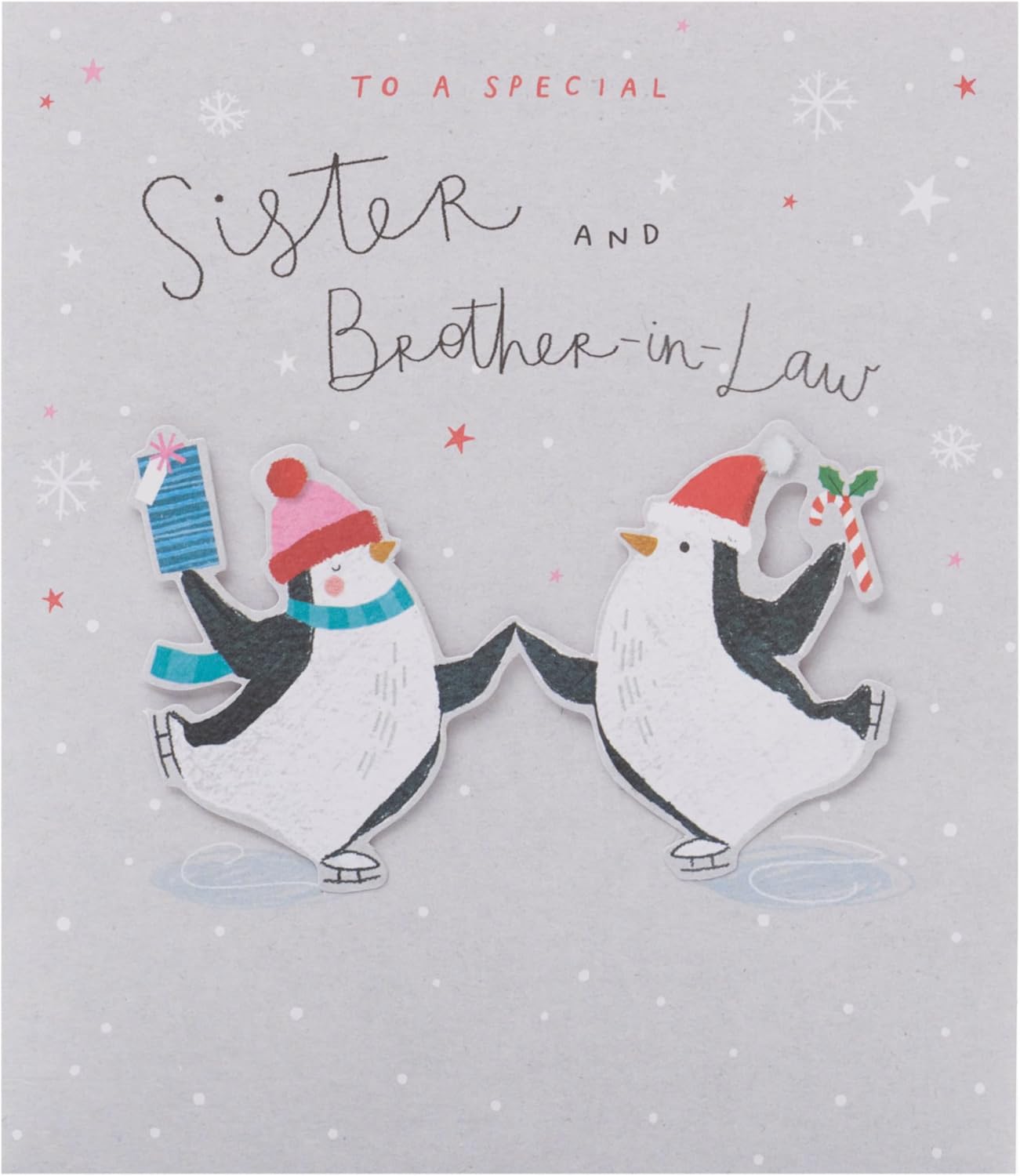 UK Greetings Christmas greeting card featuring adorable penguins ice skating, designed for sister and brother-in-law.