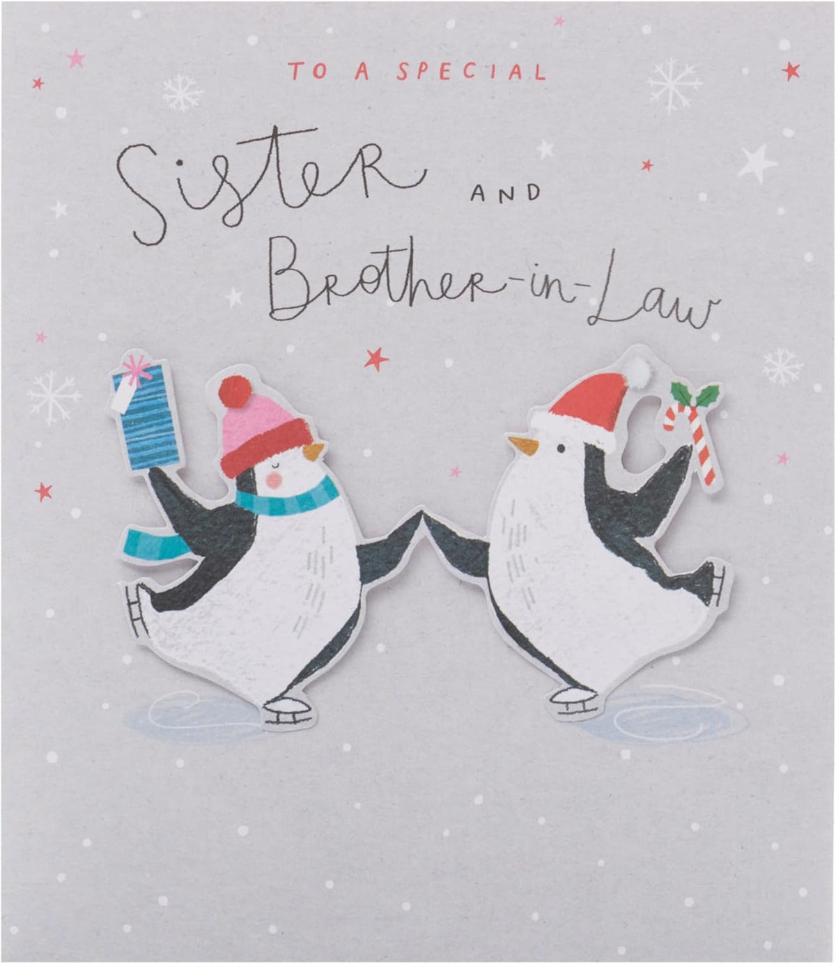 UK Greetings Christmas greeting card featuring adorable penguins ice skating, designed for sister and brother-in-law.