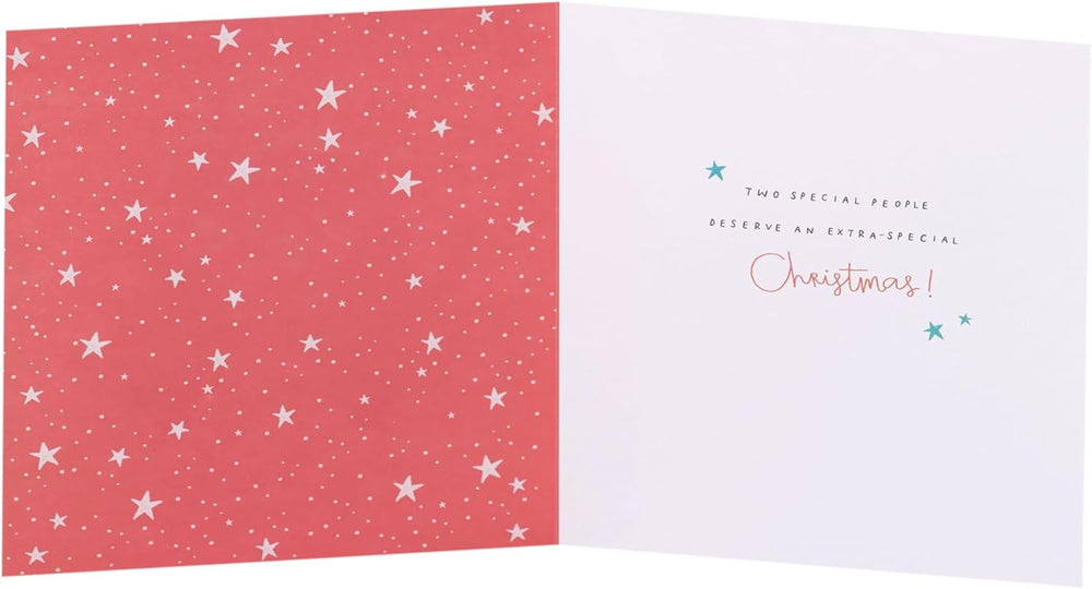 UK Greetings Christmas greeting card featuring adorable penguins ice skating, designed for sister and brother-in-law.