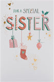 UK Greetings Christmas card for sister with hanging ornaments design, featuring festive holiday illustrations on the front.