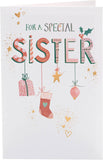 UK Greetings Christmas card for sister featuring hanging ornaments design, with festive holiday illustrations and cheerful greeting.