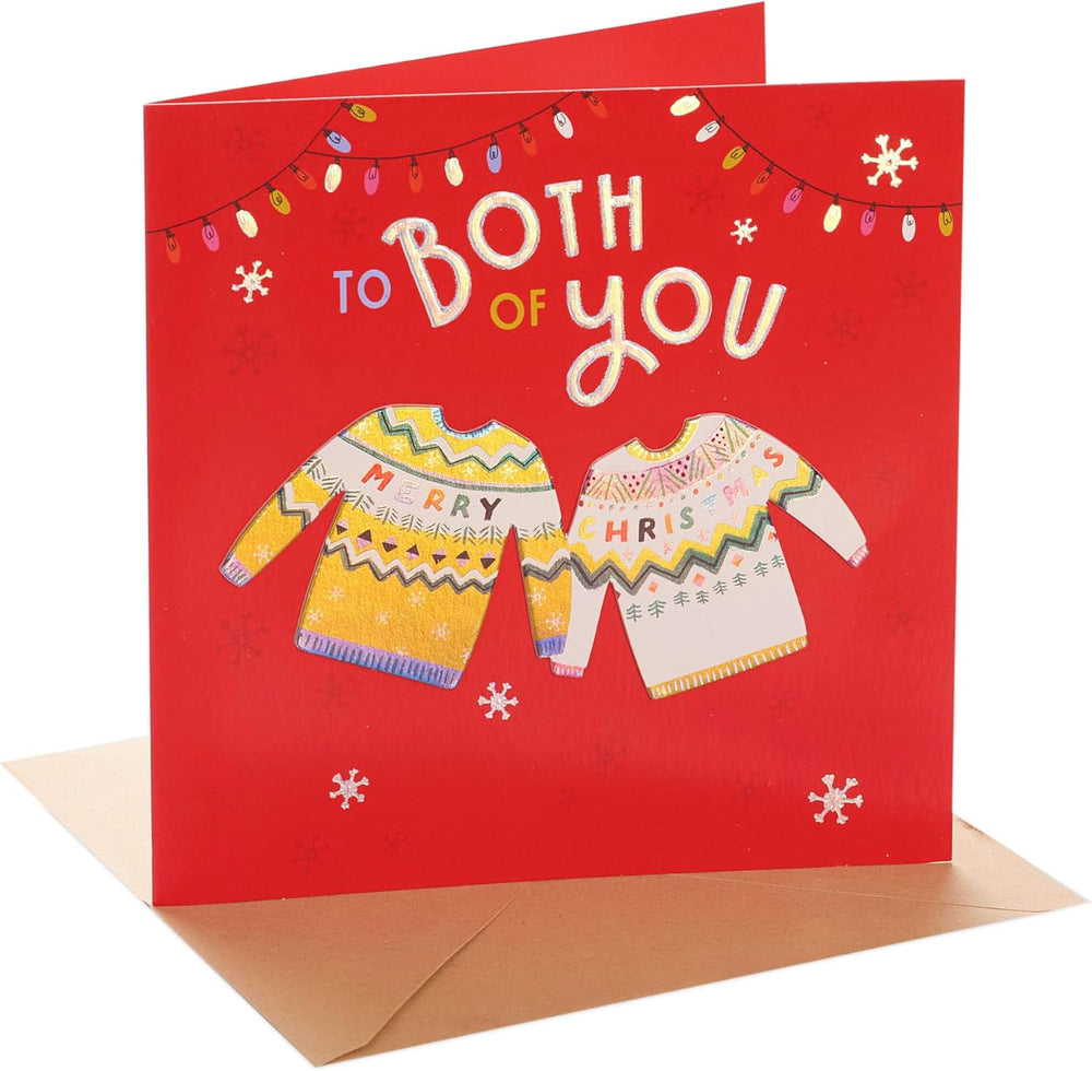 UK Greetings Christmas greeting card featuring a festive design with knitted jumper illustrations for holiday wishes.