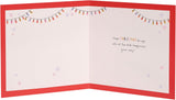 UK Greetings Christmas greeting card featuring a festive design of two knitted jumpers, perfect for holiday wishes.