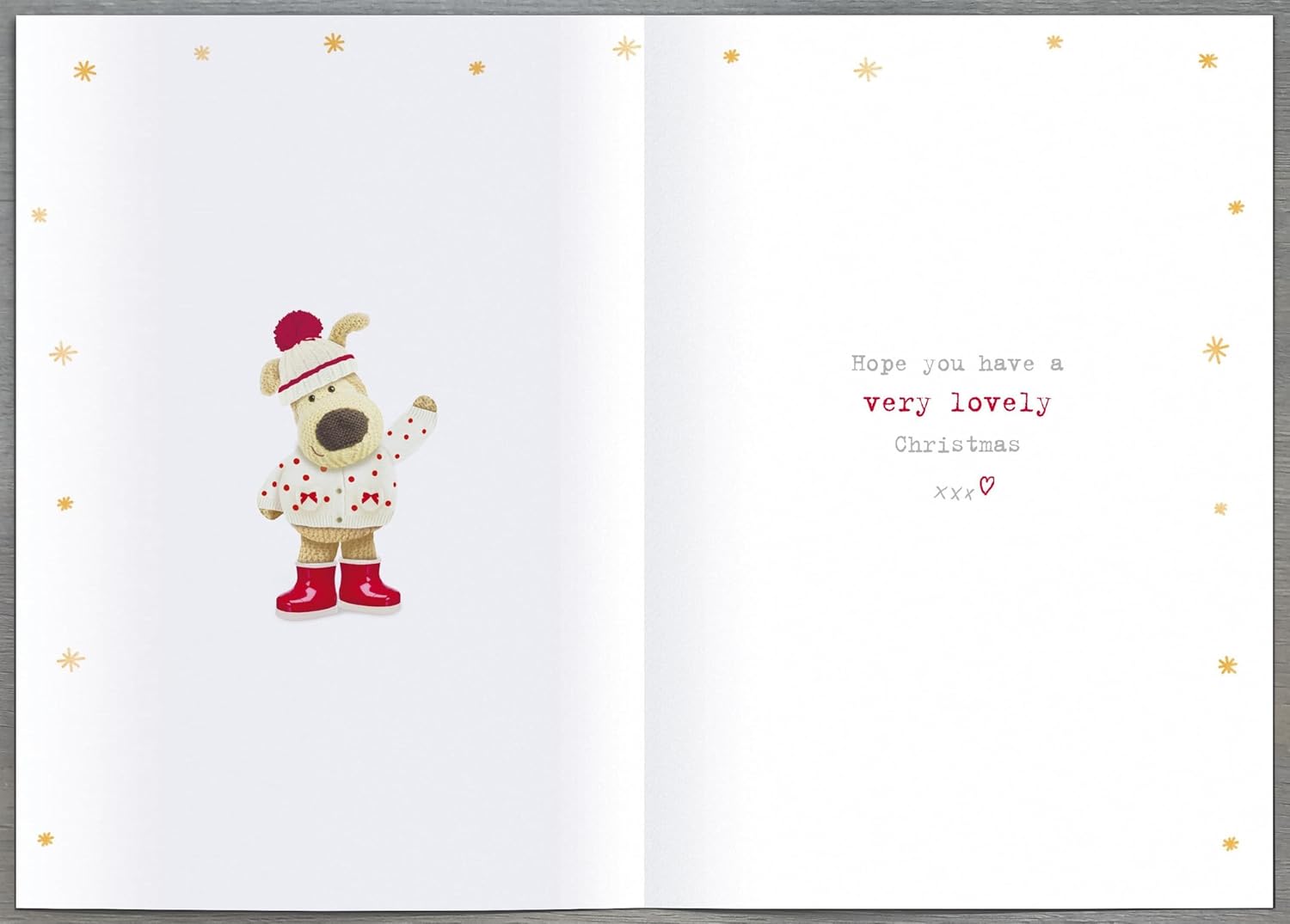 UK Greetings Christmas greeting card for Gran featuring cute Boofle and poinsettia blooms in a festive holiday design.