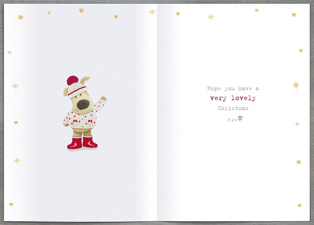 UK Greetings Christmas greeting card for Gran featuring cute Boofle and poinsettia blooms in a festive holiday design.